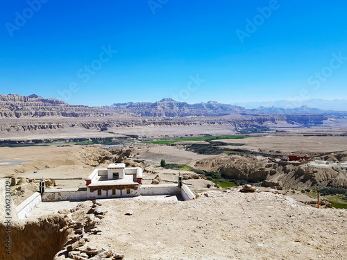 Ancient Tholing Monastery, Tibet. Ruins of ancient capital of Guge kingdom. Cave town inside a pyramid-shaped rock and a royal palace on the top.