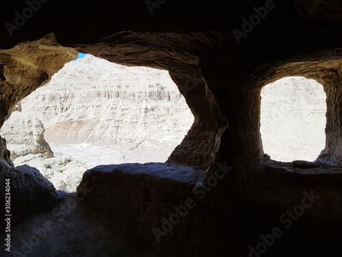 Ancient Tholing Monastery, Tibet. Ruins of ancient capital of Guge kingdom. Cave town inside a pyramid-shaped rock and a royal palace on the top. photo