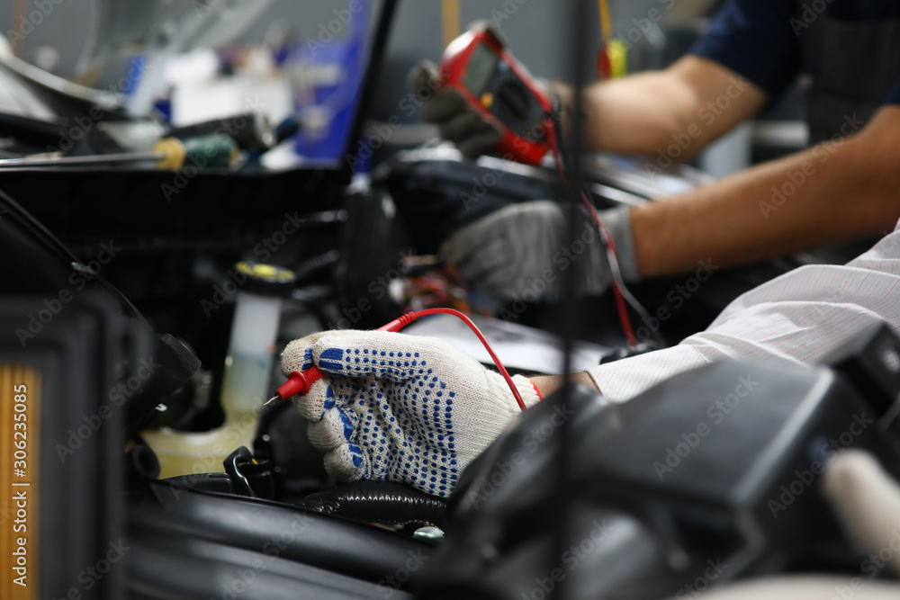 Two specialists of service for repairing wiring Two specialists of service for repairing wiring