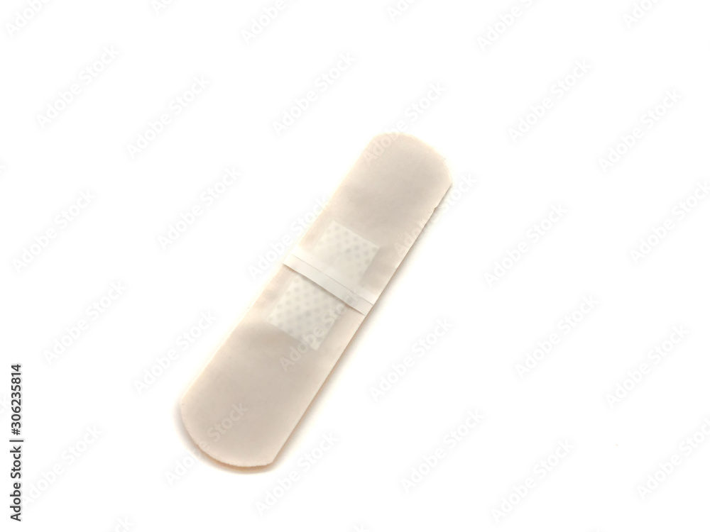 Medical plaster isolated on a white background. Brown medical plaster for first aid. Medical plaster isolated on a white background. Brown medical plaster for first aid.