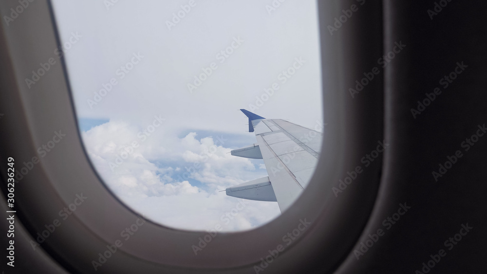 Flight during overcast weather. View from the window of the airplane on the wing, sky and clouds. Slight turbulence during the flight. Flight during overcast weather. View from the window of the airplane on the wing, sky and clouds. Slight turbulence during the flight.