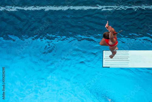 Springbord diver at outdoor pool photo