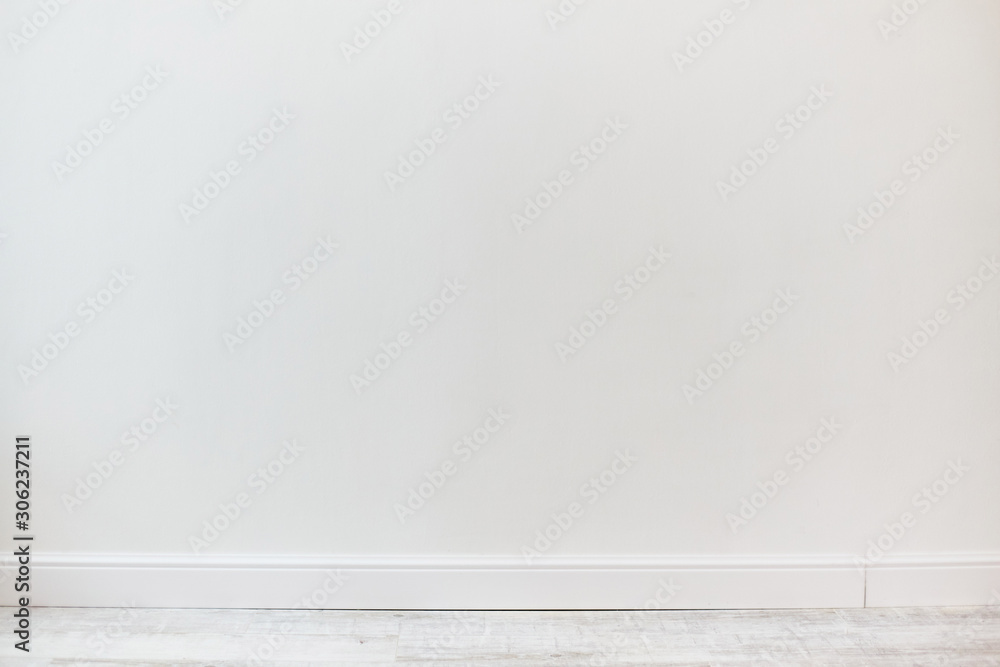 Empty room with white cement wall texture and white wooden floor pattern. 