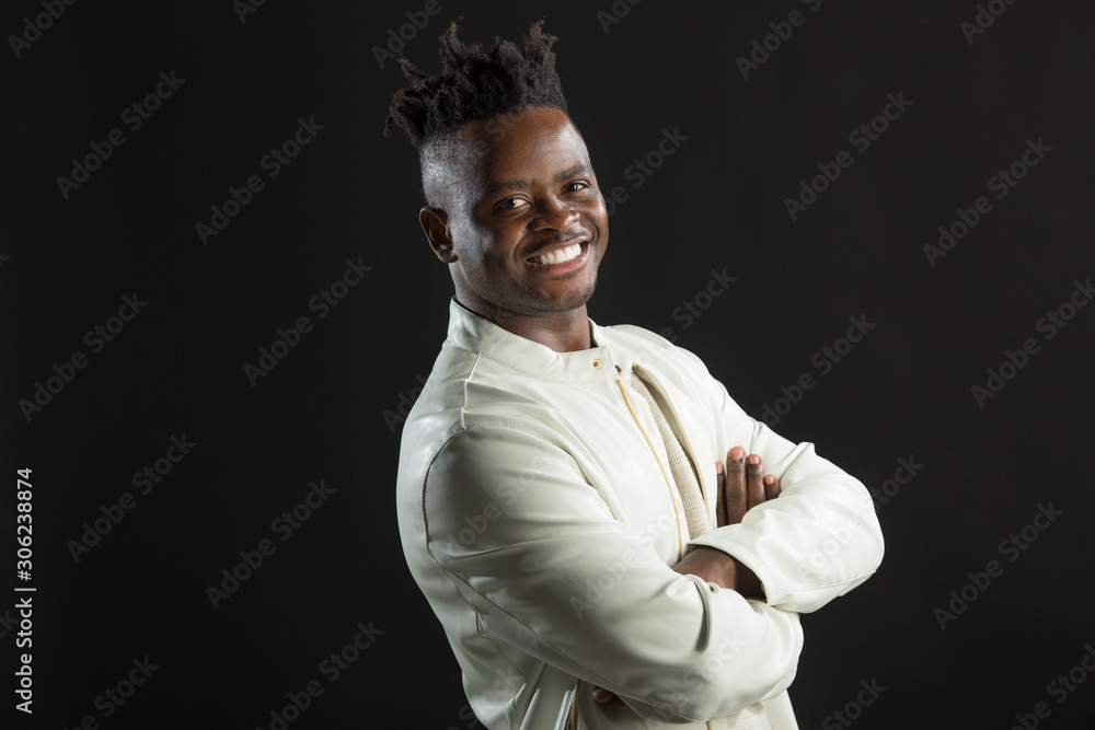 handsome african man in a white jacket on a black background handsome african man in a white jacket on a black background