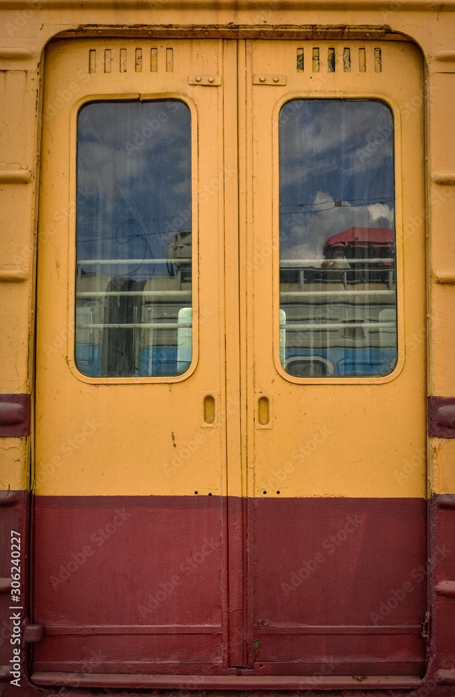metal doors on the train, orange train doors