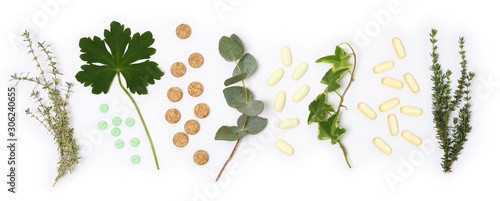 arrangement of natural pills and plants
