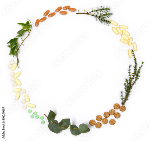 arrangement of natural pills and plants