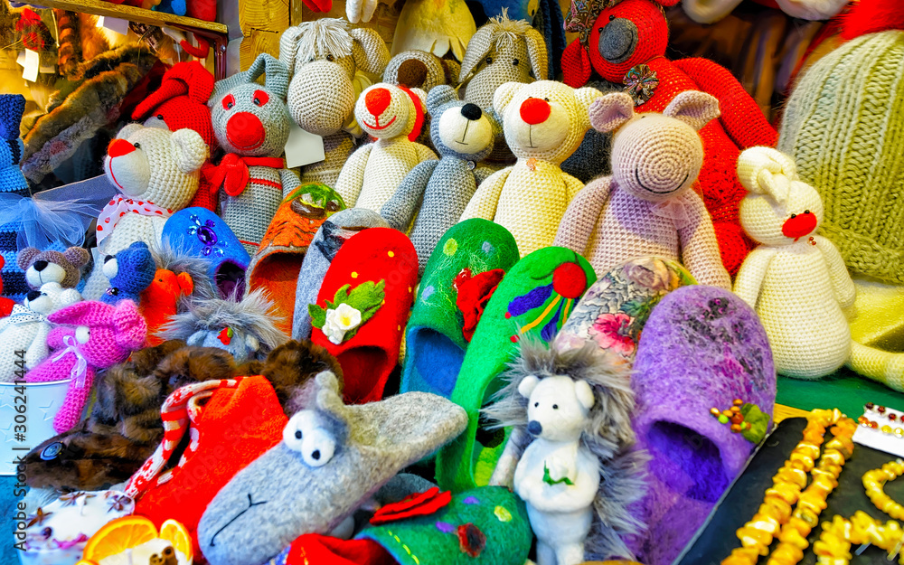 Christmas Animal Toys Decorations on Christmas Market at Riga, Latvia. Advent Fair, and Stalls with Crafts Items in Bazaar. Night street Xmas and holiday fair in European city or town, December.