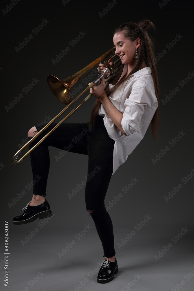 Portrait of a dancing girl with a trombone Portrait of a dancing girl with a trombone