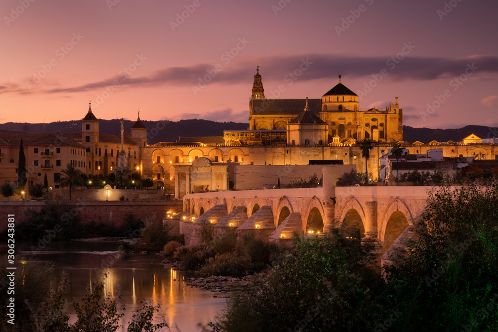 Roman Bridge and Guadalquivir river after the sunset, Great Mosque, Cordoba, Spain