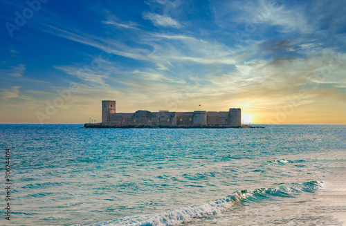 Fototapeta Naklejka Na Ścianę i Meble -  Historical, Ancient Kizkalesi, Kiz Kalesi or Maiden's Castle with Korykos Ruins in Mersin Beach from Turkey near Mediterranean Sea. 