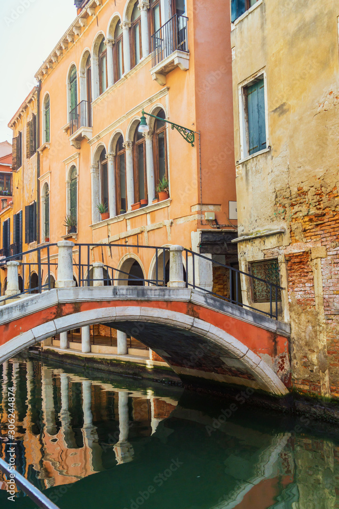Venice, Italy. Low stone bridge over the canal Venice, Italy. Low stone bridge over the canal