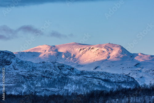 Snowy peaks of mountains in morning light