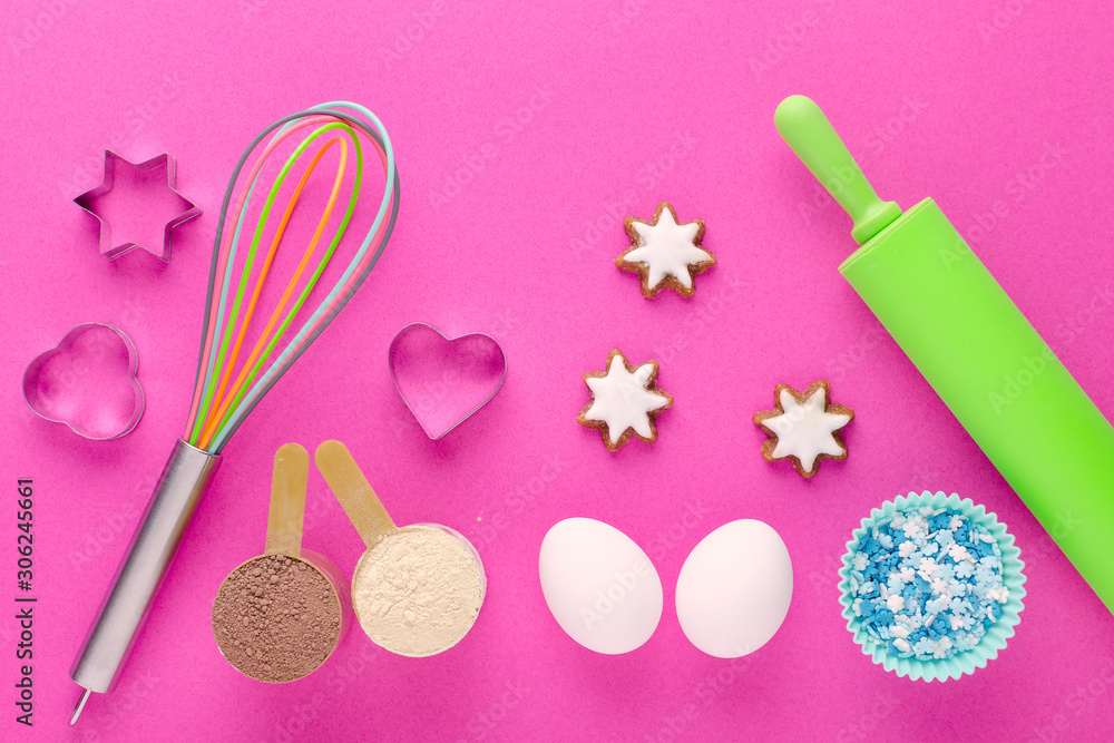 baking protein, eggs and kitchen tools with cookie cutter on pink background