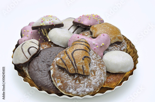 Gingerbread on golden Plate, close up, isolated on white Background