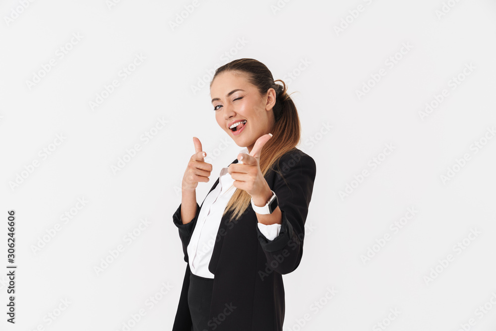 Photo of funny businesswoman winking and pointing fingers at camera Photo of funny businesswoman winking and pointing fingers at camera