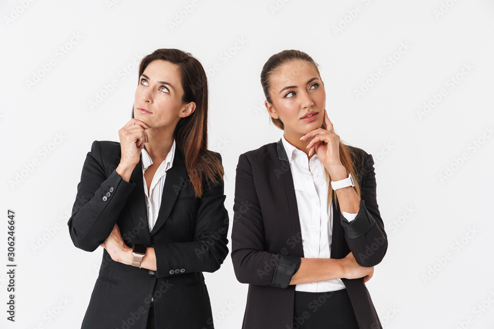 Photo of thinking businesswomen posing and looking aside Photo of thinking businesswomen posing and looking aside