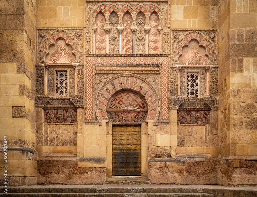 A beautiful wall decoration with stone carving outside The Mosque–Cathedral of Cordoba