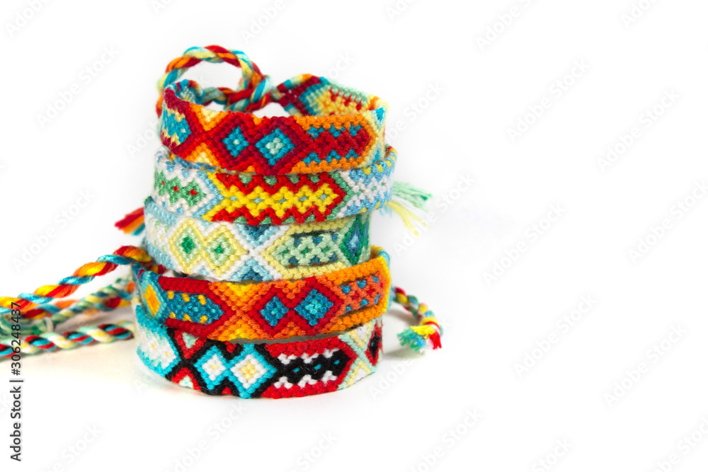 handmade friendship bracelets on white background, ethno boho style