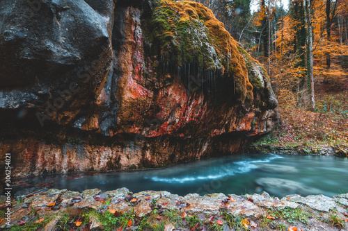 Kallektuffquell waterfall on Mullerthal trail in Luxembourg longexposure crystal clear water autumn fall in November