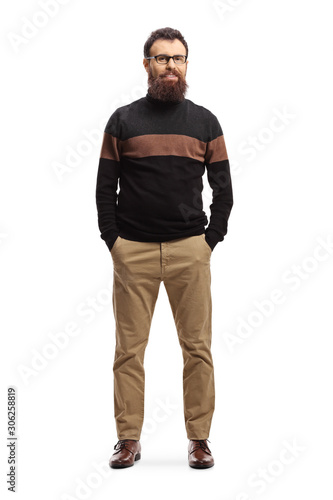 Bearded man in a turtleneck sweater posing