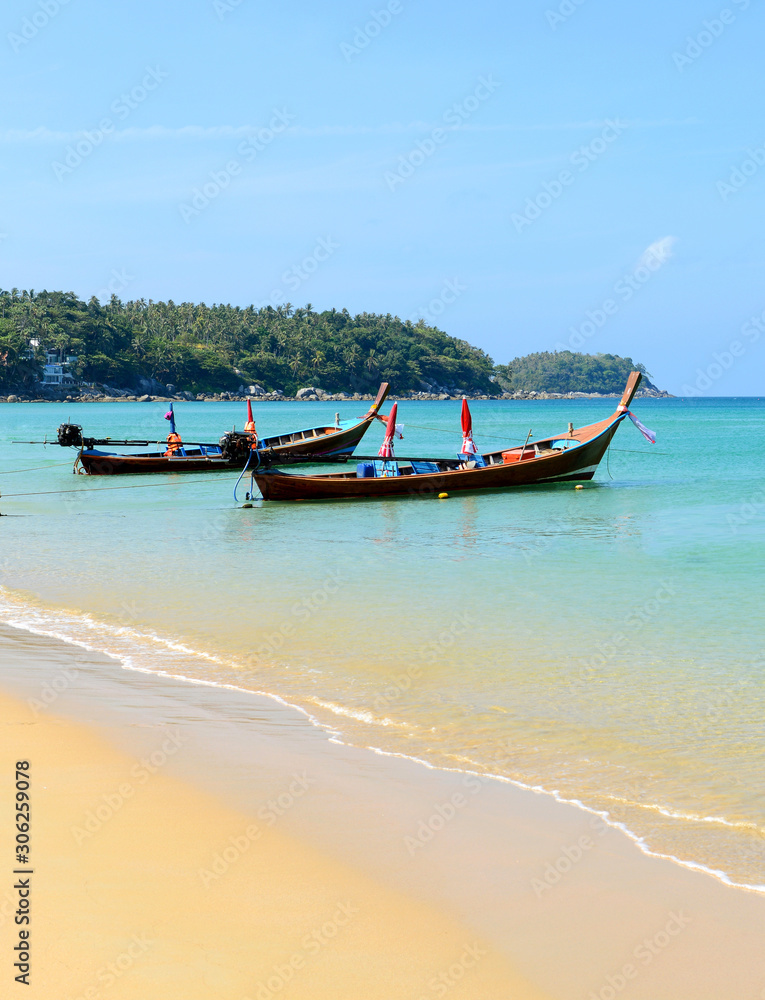 Long boat and tropical beach