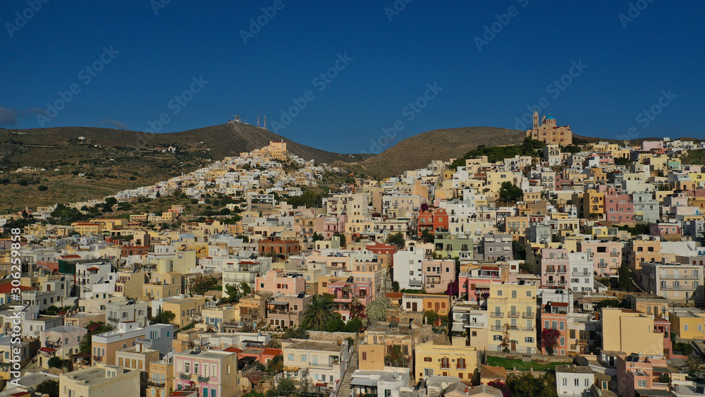 Aerial drone photo of iconic uphill catholic settlement of ano Syra featuring church of Saint George with beautiful colours, Syros or Siros island, Cyclades, Greece