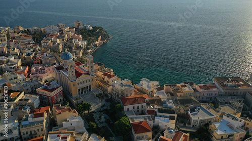 Aerial drone photo of picturesque district built by the sea of Vaporia in main town of Syros or Siros island Ermoupolis and famous church of Agios Nikolaos, Cyclades, Greece