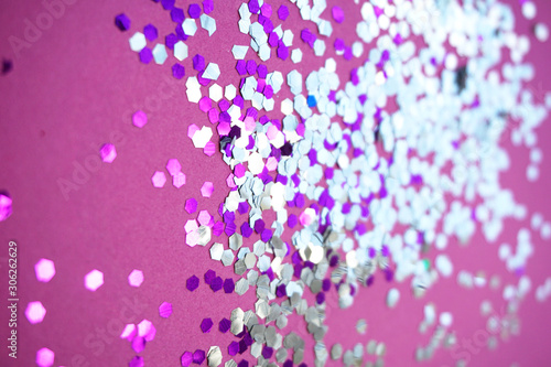 Silver sparkles on pink background