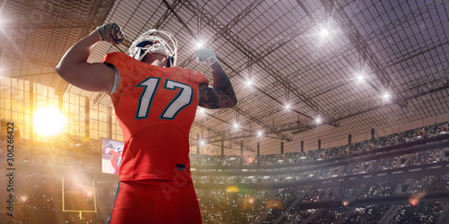 Photos American football players on professional stadium on sunset.