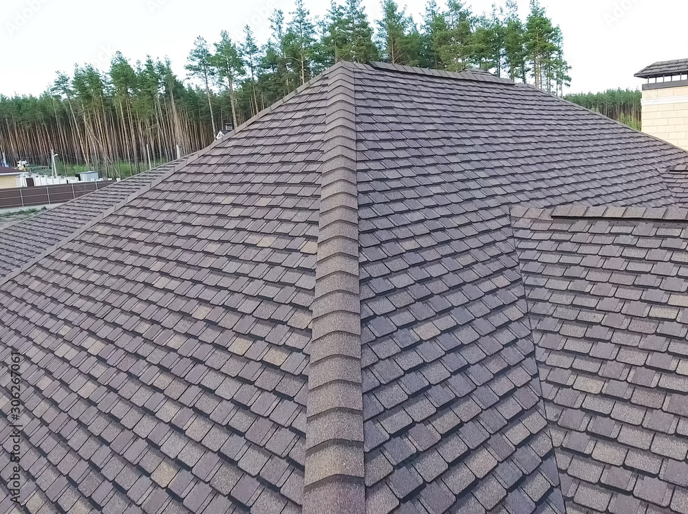 Fototapeta premium Bituminous tile for a roof. House with a roof from a bituminous