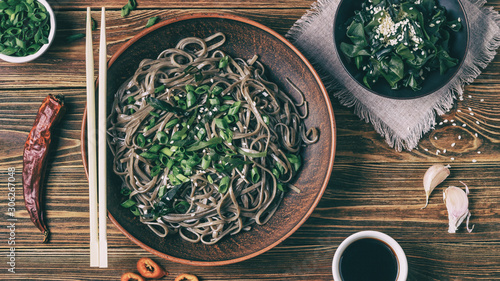 Billede på lærred Still life with top view of traditional japanese soba noodles with nori (edible