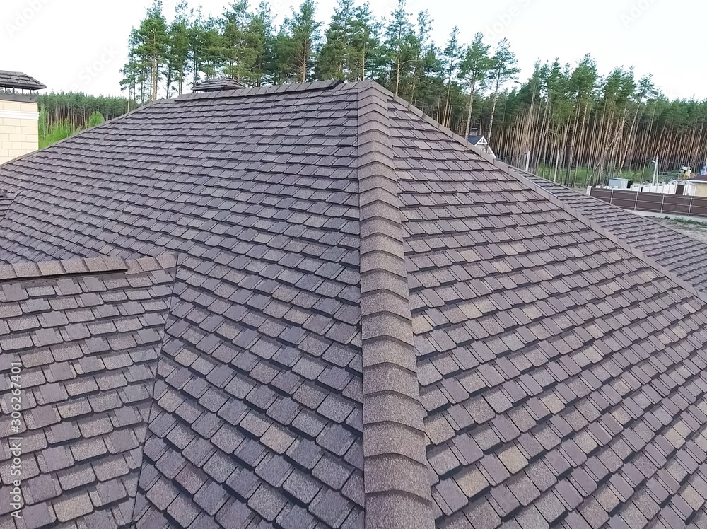 Fototapeta premium Bituminous tile for a roof. House with a roof from a bituminous