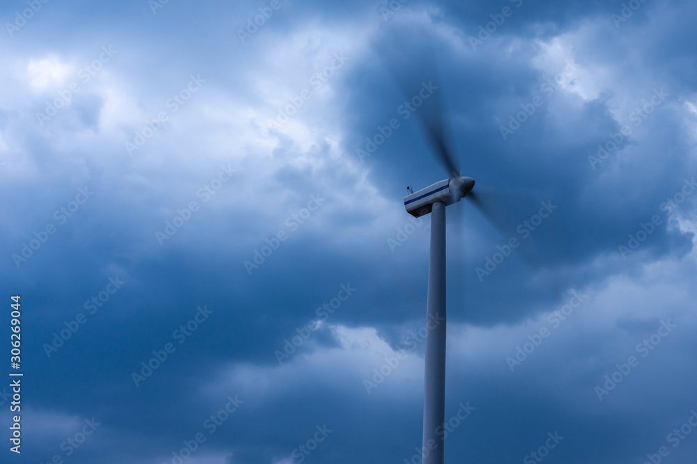 Windmills during a heavy storm. Very strong wind
