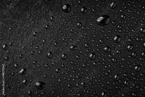 Water droplets on black background photo