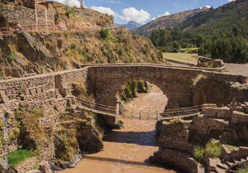 The colonial Checacupe bridge is located on the Ausangate or Pitumayu river, Cusco Peru photo