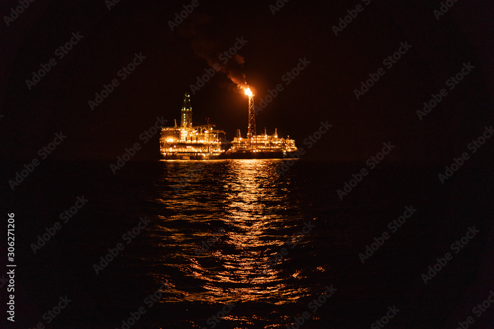 Night view of FPSO tanker vessel near Oil Rig. Offshore oil and gas ...