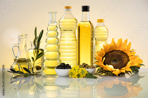Healthy oil from sunflower, olive, rapeseed oil. Cooking oils in bottle photo