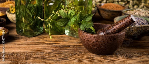 Fotografie Herbs medicine and vintage wooden background