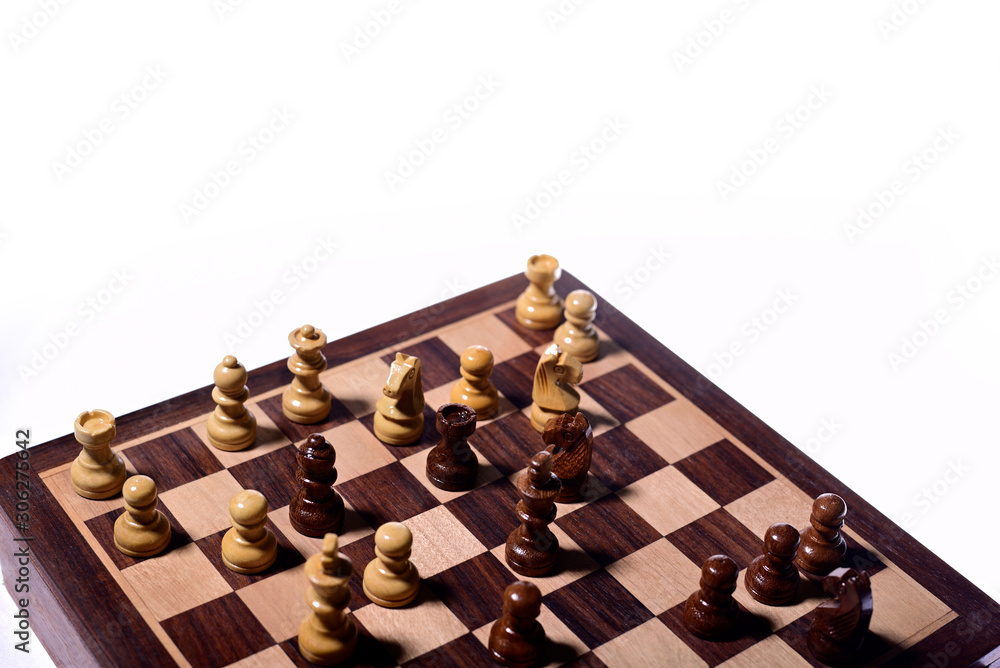 Top angle shot of chess pieces on chessboard against white background. Wooden chess pieces. Top angle shot of chess pieces on chessboard against white background. Wooden chess pieces.