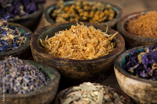 Herbs medicine and vintage wooden background