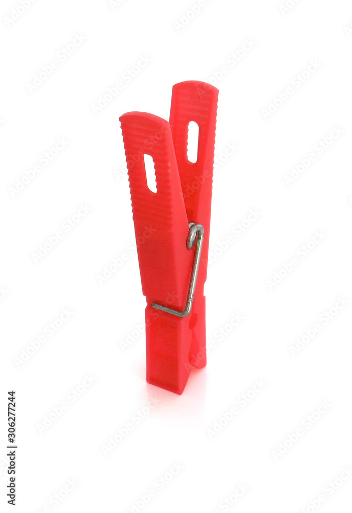 Isolated red  plastic clothespin on white background.