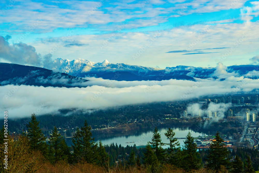 Cloud inversion over Port Moody BC, with snow-clad North Shore mountains in background
