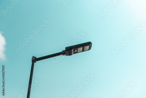 Solar cell smart street lamp with blue sky background in day time,Street light in park,Lamp park.