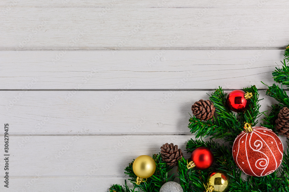 Christmas fir tree with decoration on white wooden board Christmas fir tree with decoration on white wooden board