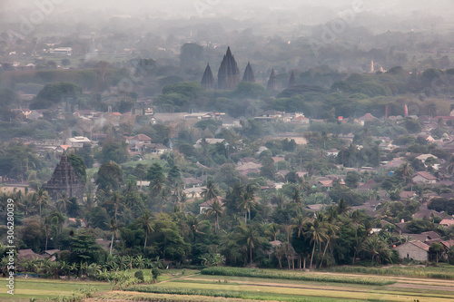 Beautiful foggy natural scenery in the morning. Panoramic of the Prambanan temple.