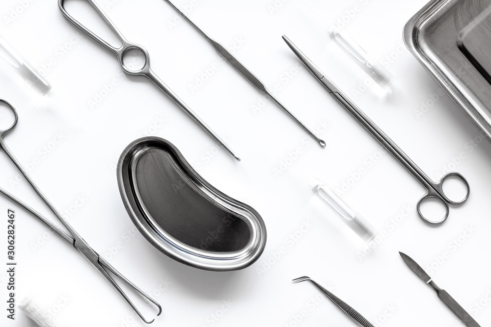 Instruments for plastic surgery on white background top view flat lay pattern Instruments for plastic surgery on white background top view flat lay pattern