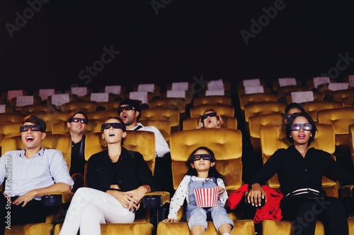 group of people watching 3d movie in cinema