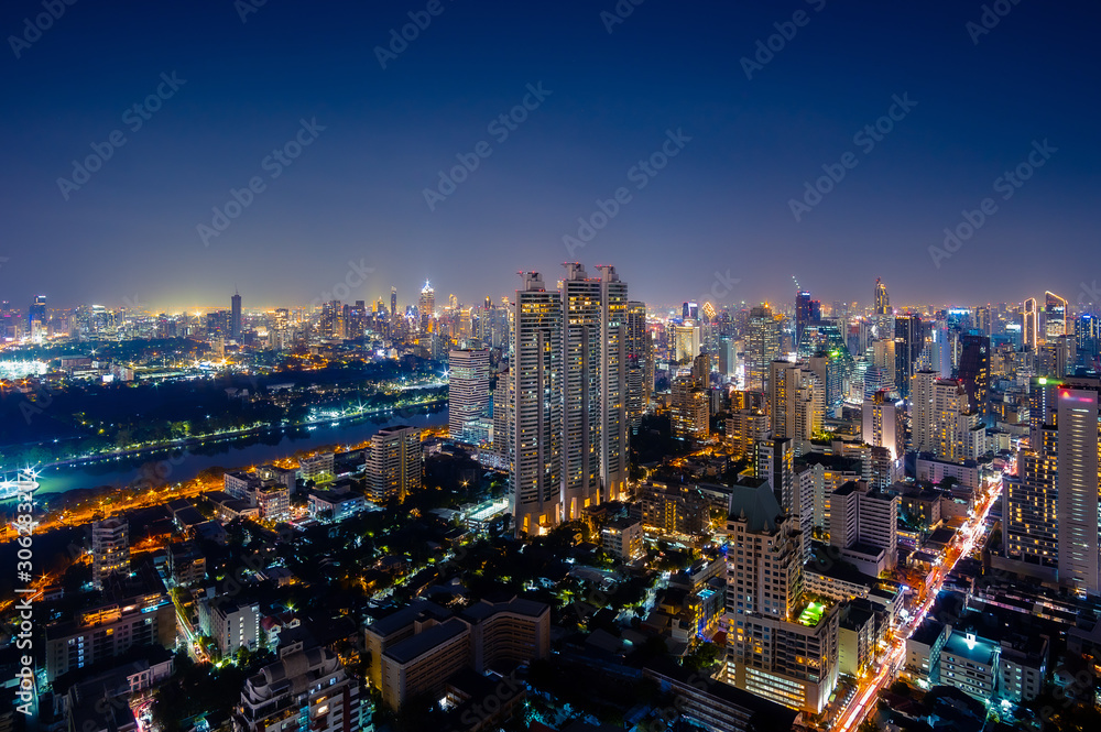 Fototapeta premium Cityscape night view of Bangkok modern City business building and high skyscraper at Bangkok,Thailand.