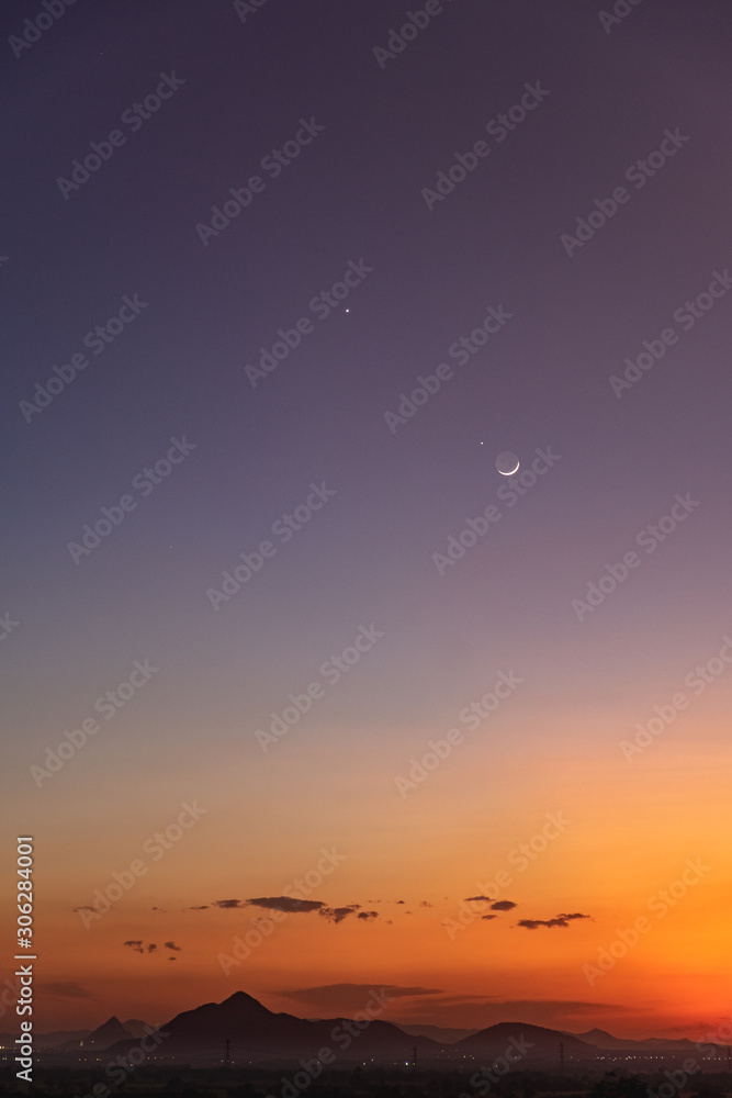 Crescent moon with beautiful sunset background . Generous Ramadan stars